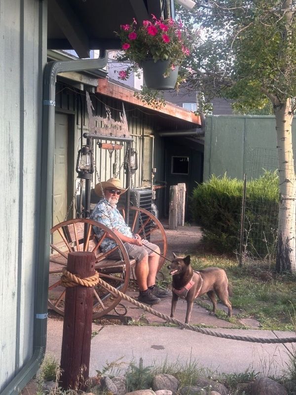 Relaxing on the porch swing with trail dog