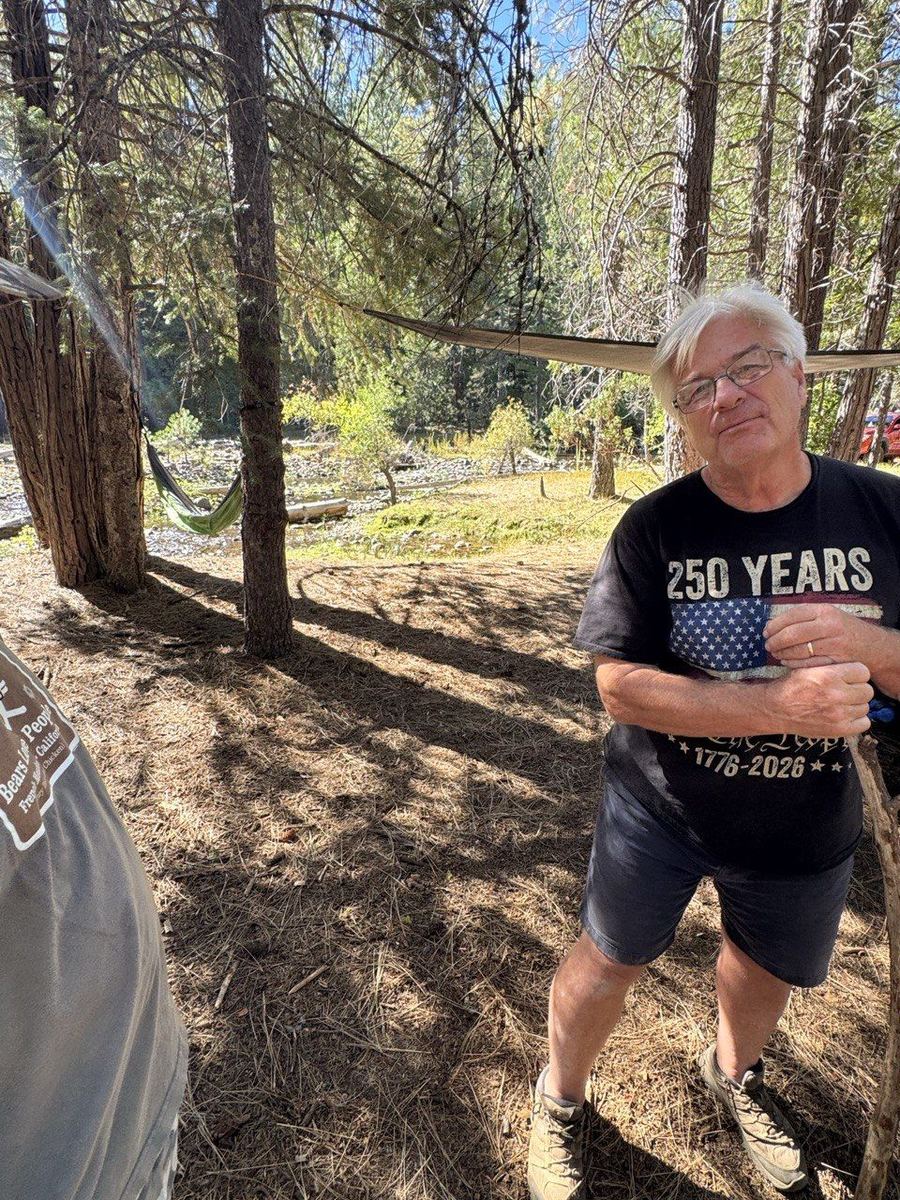 Exploring the pines with walking stick in hand